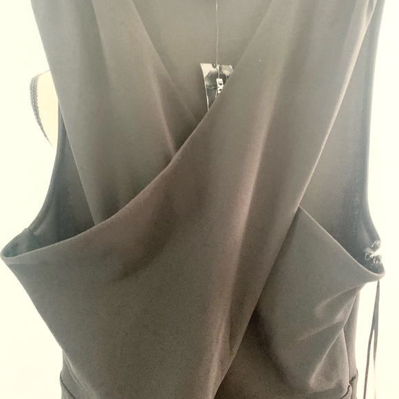 Express Black stretch jumpsuit. Low v neck front & opening below breast line. - Picture 5 of 9